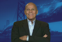 Harry Belafonte with blue bridge background