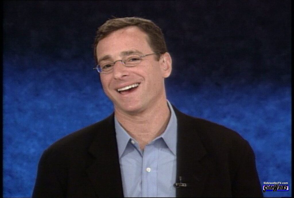 Bob Saget laughing in a single shot