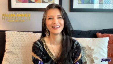 Kelly Hu siting and smiling
