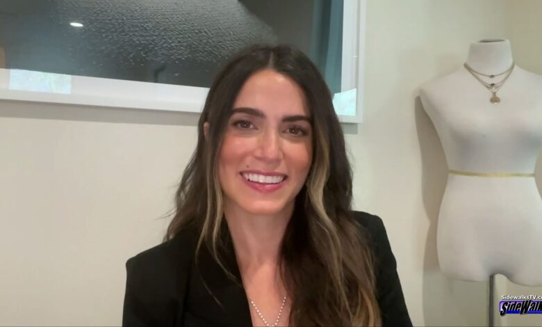 Nikki Reed smiles