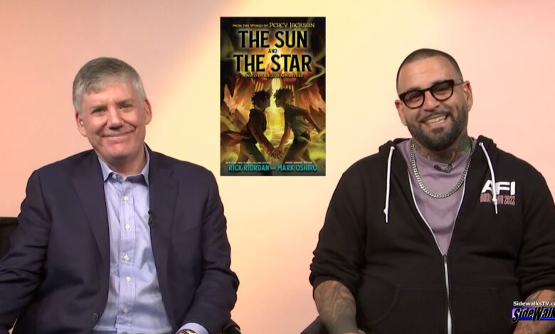 Rick Riordan and Mark Oshiro smile