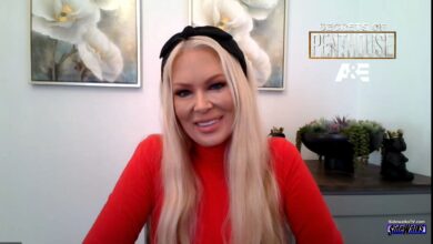 Jenna Jameson smiles in a red top