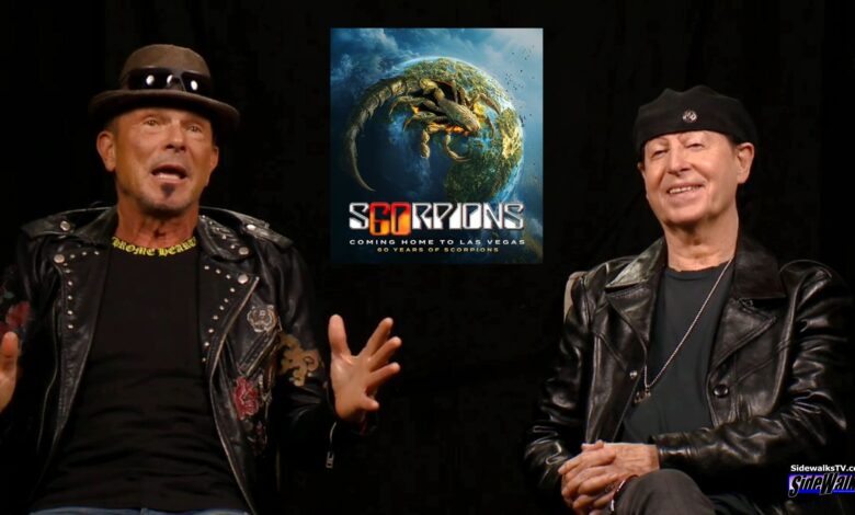 Rudolf Schenker with hands raise and Klaus Meine