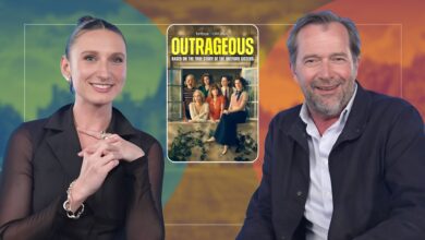 Bessie Carter and James Purefoy with Outrageous poster in the middle