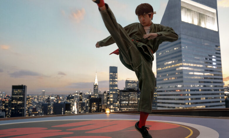 Ben Wang with his leg up high in still photo