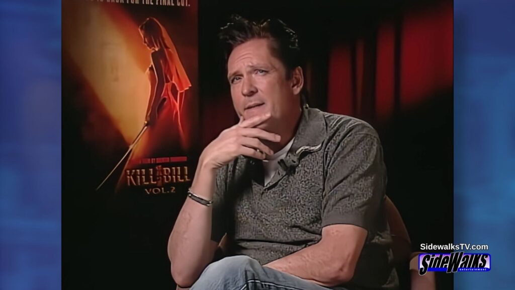 Michael Madsen thinking with his hand under his chin