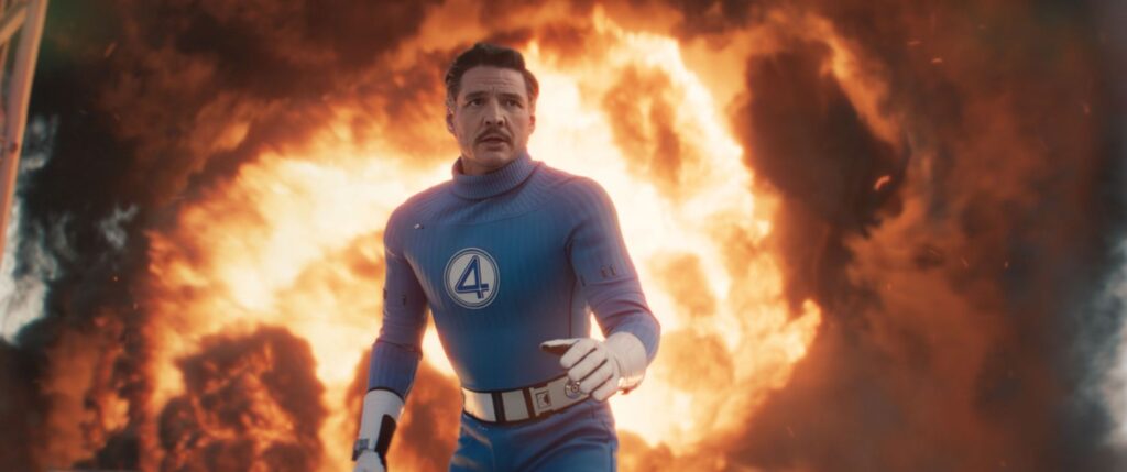 Pedro Pascal as Reed Richards/Mister Fantastic with fire behind him