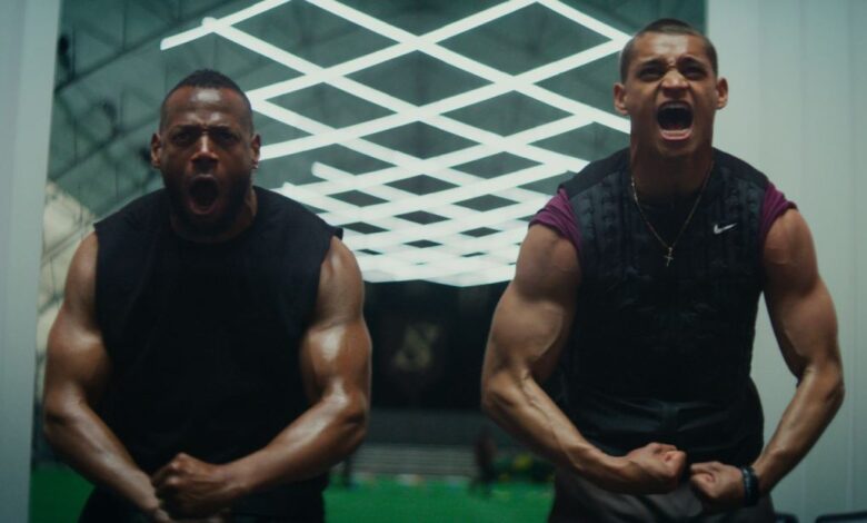 Isaiah White (Marlon Wayans) and Cameron Cade (Tyriq Withers) in a still photo flexing their muscles