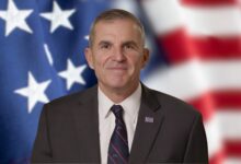 Lt. Gen. (Ret.) Michael Linnington with American flag in the background