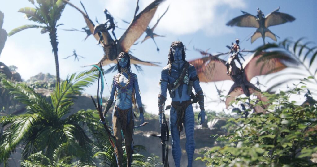 Jake Sully and Neytiri standing in a lush jungle environment on Pandora with Ikrans flying overhead.