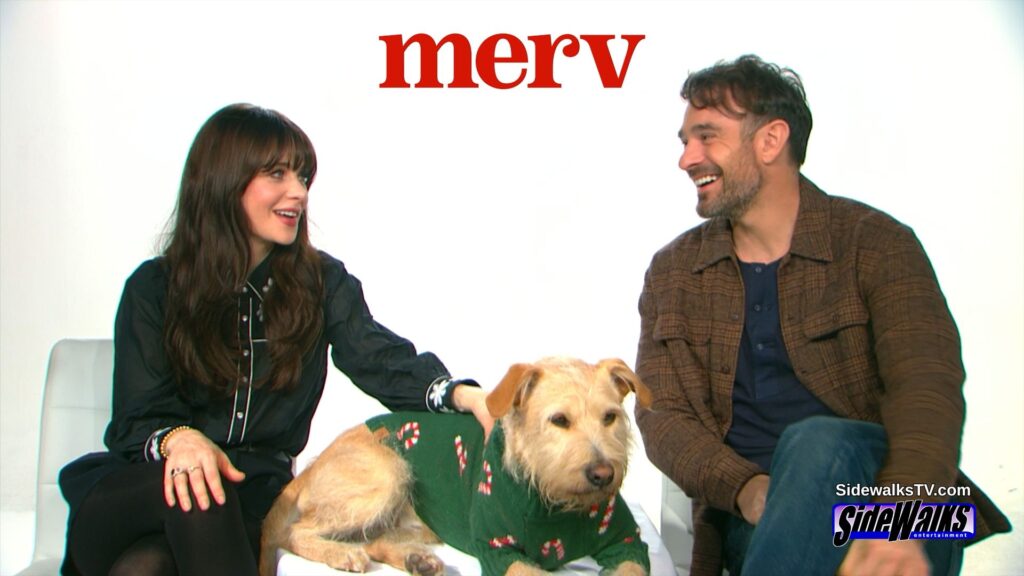 Zooey Deschanel and, Charlie Cox looking at each other with Gus 