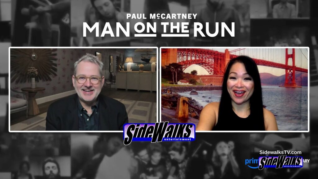 All smiles with Morgan Neville and host Lori Rosales in a two-box.