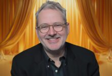 Morgan Neville with a curtain behind him