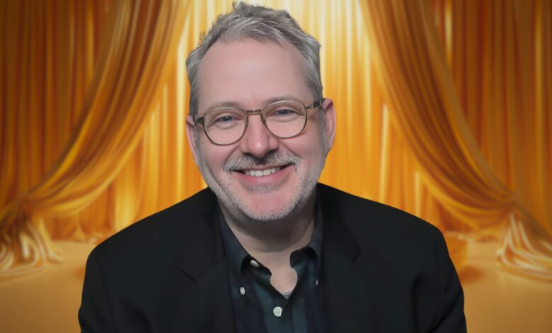 Morgan Neville with a curtain behind him