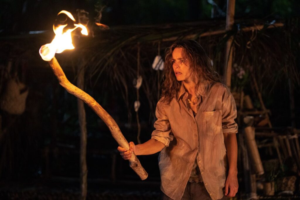 Rachel McAdams holding a stick with fire