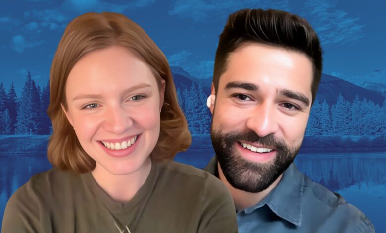 Close-up of Scarlet Hunter and Markian Tarasiuk smiling against a blue-tinted mountain and lake background.