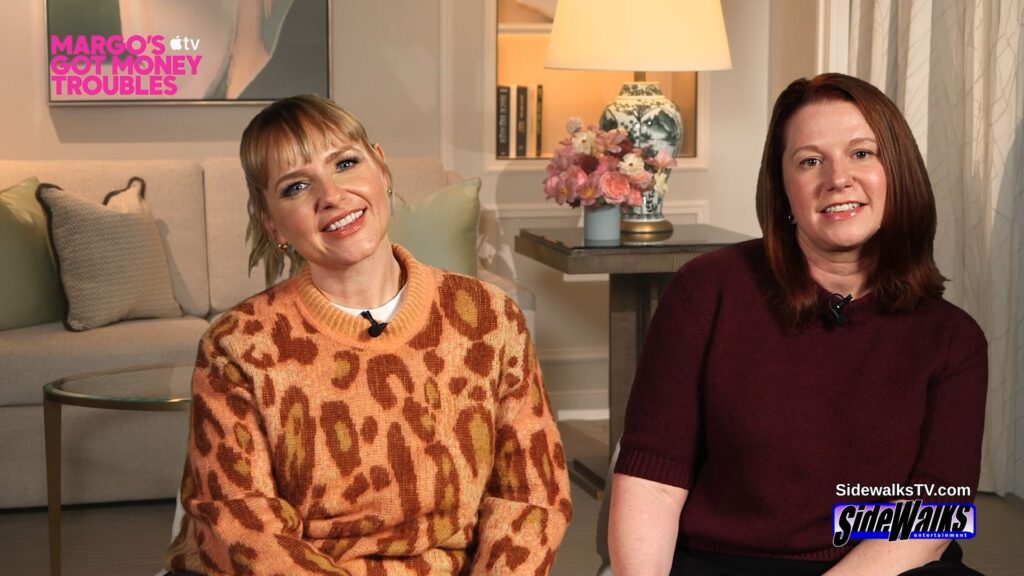 Rufi Thorpe and Eva Anderson sitting on set smiling