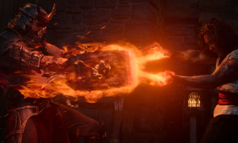 Martyn Ford as “Shao Kahn” and Ludi Lin as “Liu Kang” in a production still.