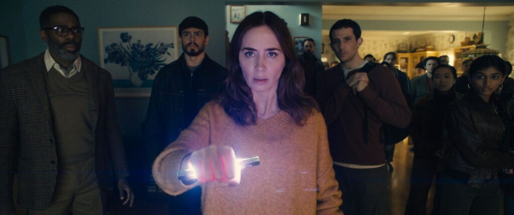 Colman Domingo is Hugo Wakefield, Tommy Martinez is Santiago, Emily Blunt is Margaret Fairchild, and Josh O'Connor is Dr. Daniel Kellner in a still of "Disclosure Day."