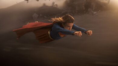 Milly Alcock as SUPERGIRL flying in the sky.