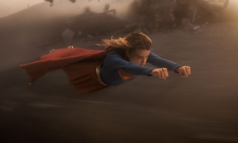 Milly Alcock as SUPERGIRL flying in the sky.
