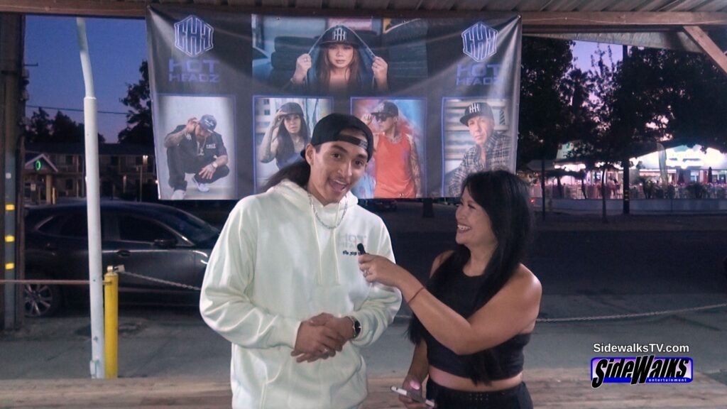 Leon Tha Lion is interviewed by host Lori Rosales