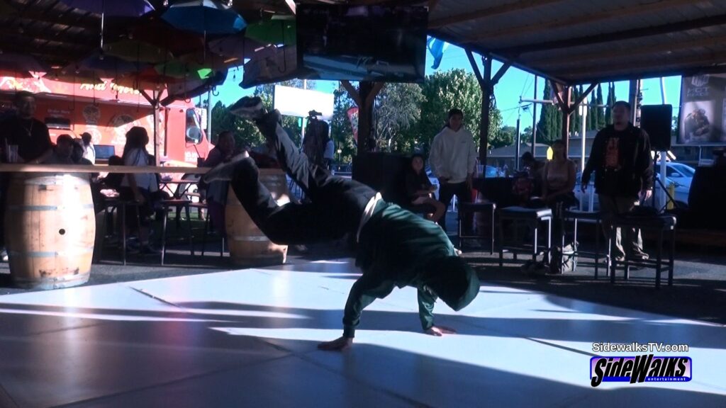 One of the judges, Scar, performs for the croud.