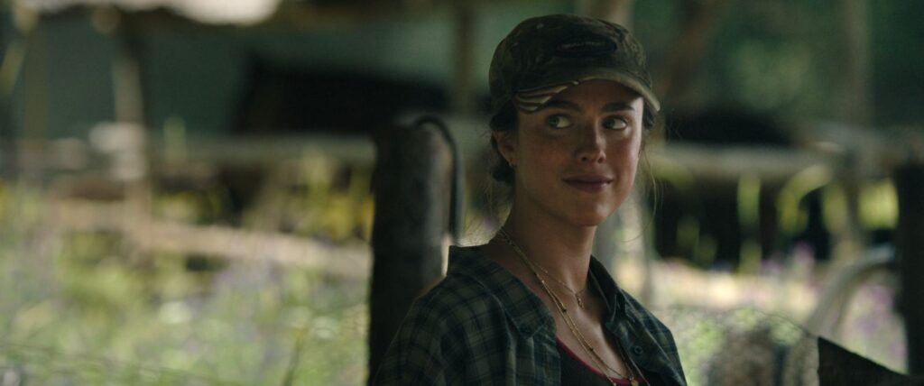 Margaret Qualley as Cima looking right.