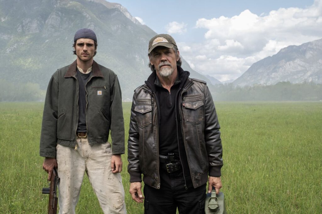 Jacob Elordi as Hig and Josh Brolin as Bangley standing outdoors