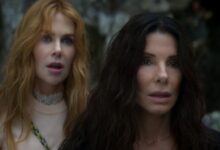 NICOLE KIDMAN as Gillian Owens and SANDRA BULLOCK as Sally Owens standing next to each other.