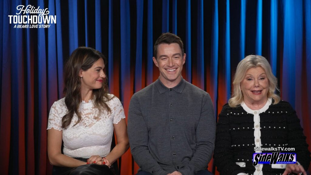 Lyndsy Fonseca looking toward Robert Buckley and Marsha Mason.