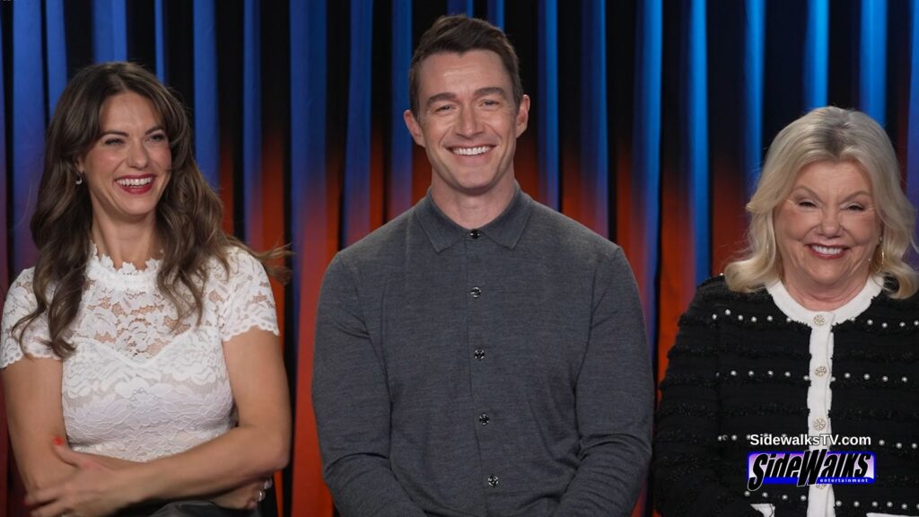 Lyndsy Fonseca, Robert Buckley and Marsha Mason smile.